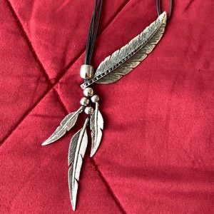 Metal feather pattern necklace. Handcrafted in India.